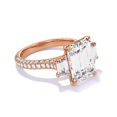 emerald cut three stone engagement ring in rose gold