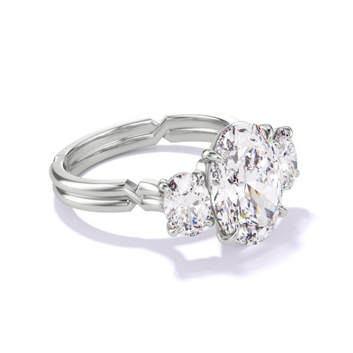 Platinum Oval Engagement Ring with a Three Stone Chance Setting