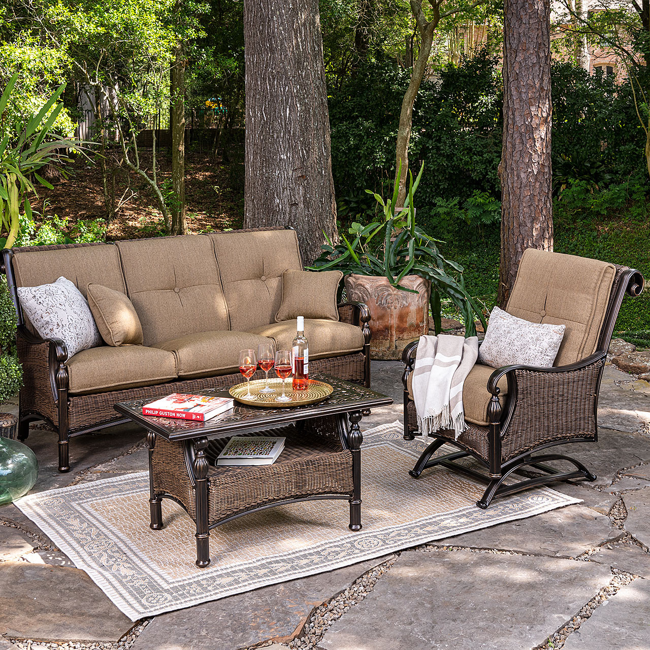 Image of Wicker patio set with sofa, chairs, and coffee table