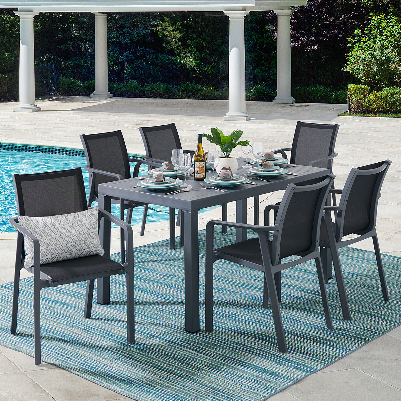 Pacifica Dark Grey Polypropylene and Black Sling 7 Pc. Dining Set with 55 x 35 in. Table