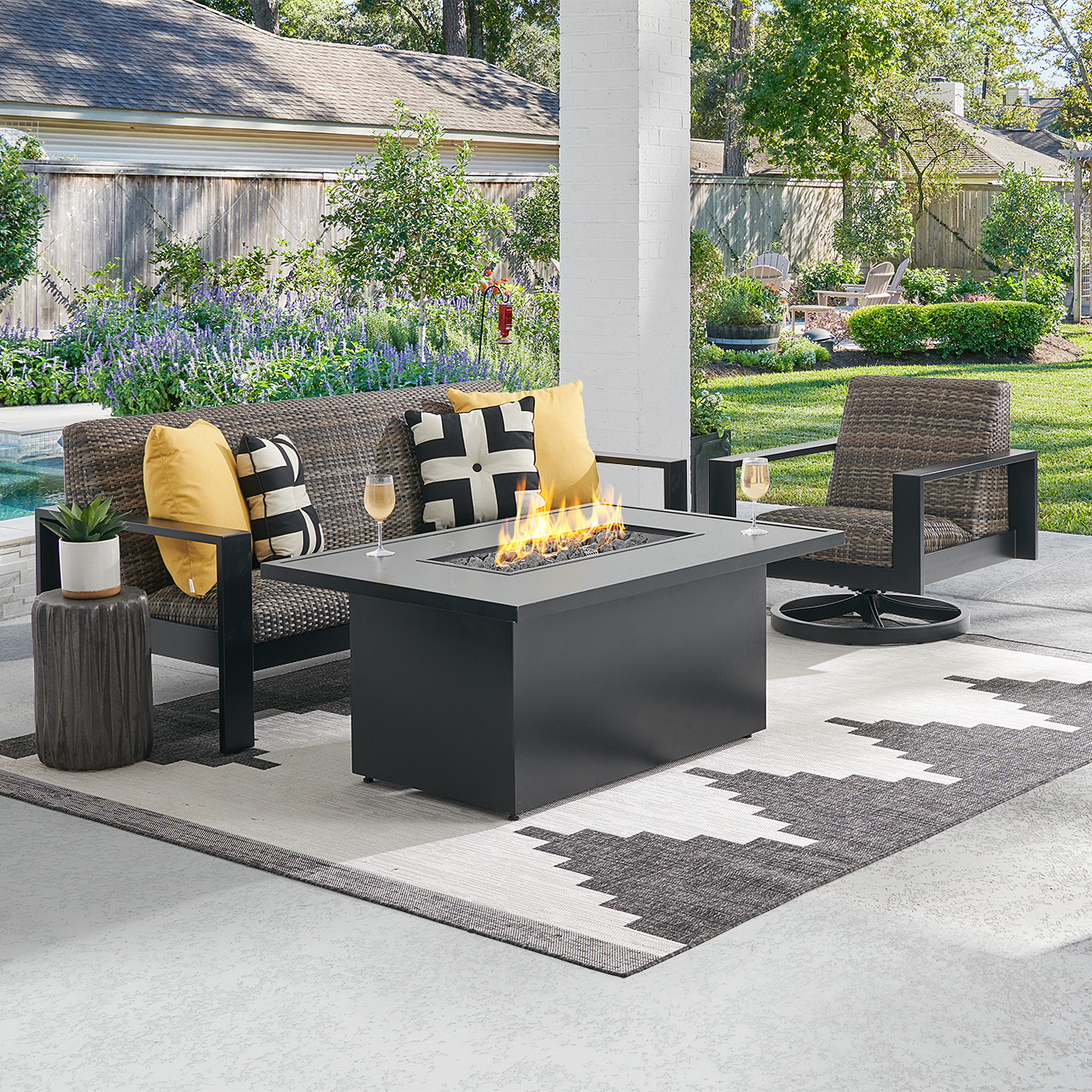 Chelsea Textured Black Aluminum and Weathered Teak Outdoor Wicker Concealed Cushions 3 Piece Swivel Sofa Group + 52 x 32 in. Fire Pit Table Chelsea Textured Black Aluminum and Weathered Teak Outdoor Wicker Concealed Cushions 3 Piece Swivel Sofa Group + 52 x 32 in. Fire Pit Table