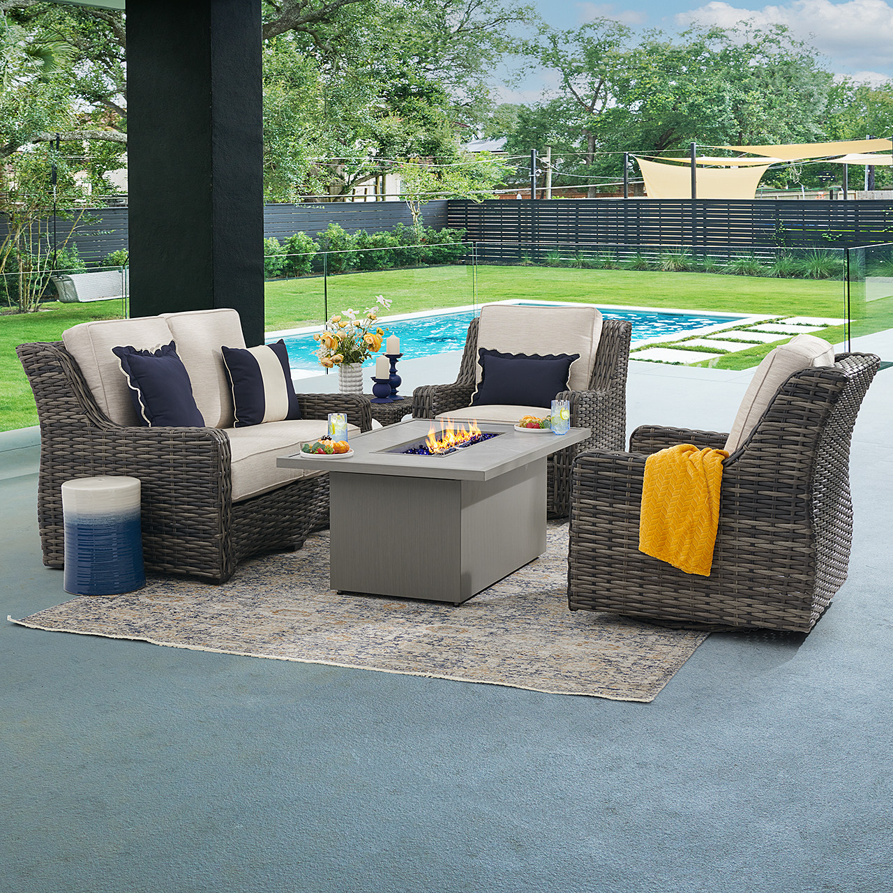 Tangiers Canola Seed Outdoor Wicker and Charmer Limestone Cushions 4 Piece Swivel Loveseat Group + 52 x 32 in. Fire Pit Table