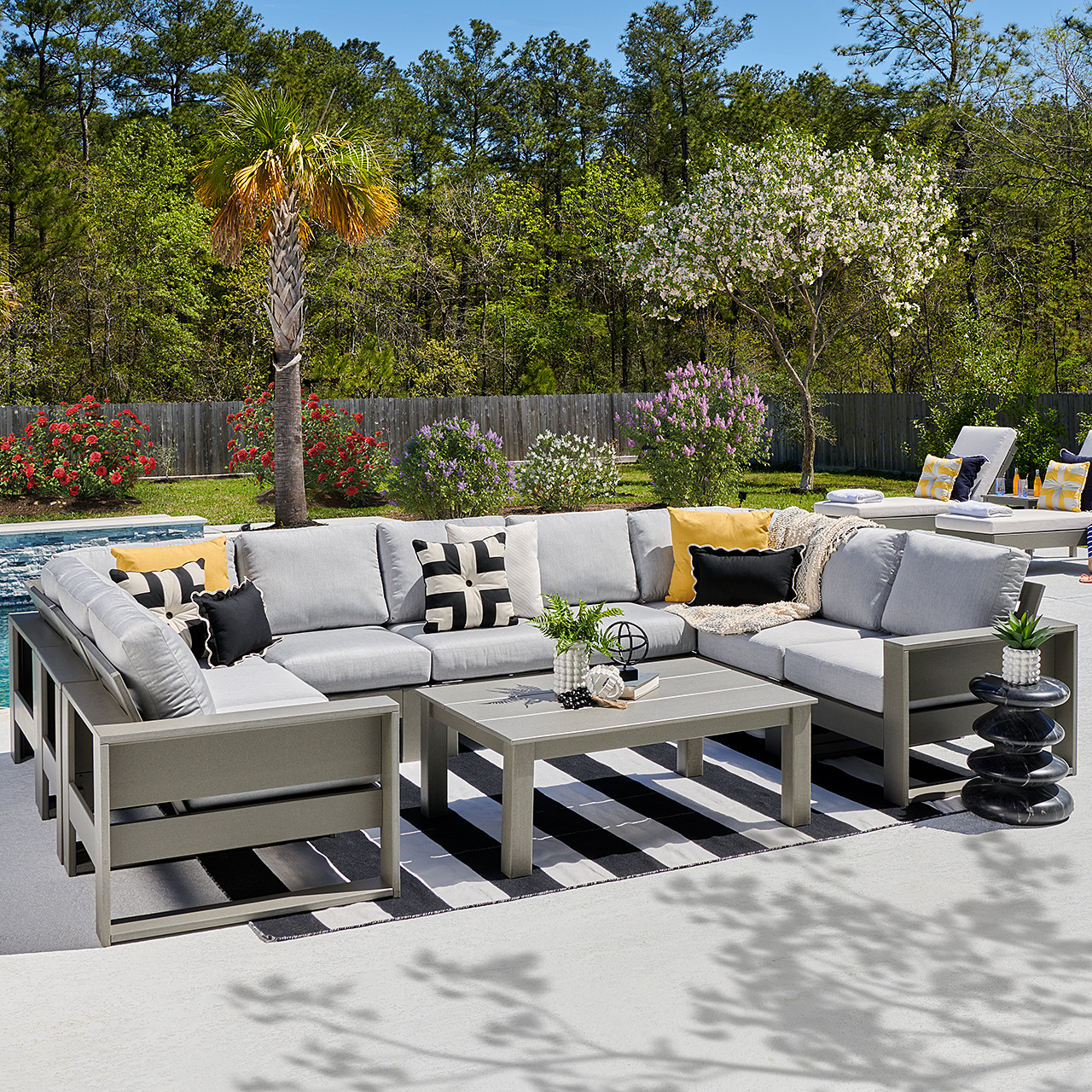 Montauk Polymer with Cushions 10 Piece Modular Sectional + 45 x 31 in. Coffee Table