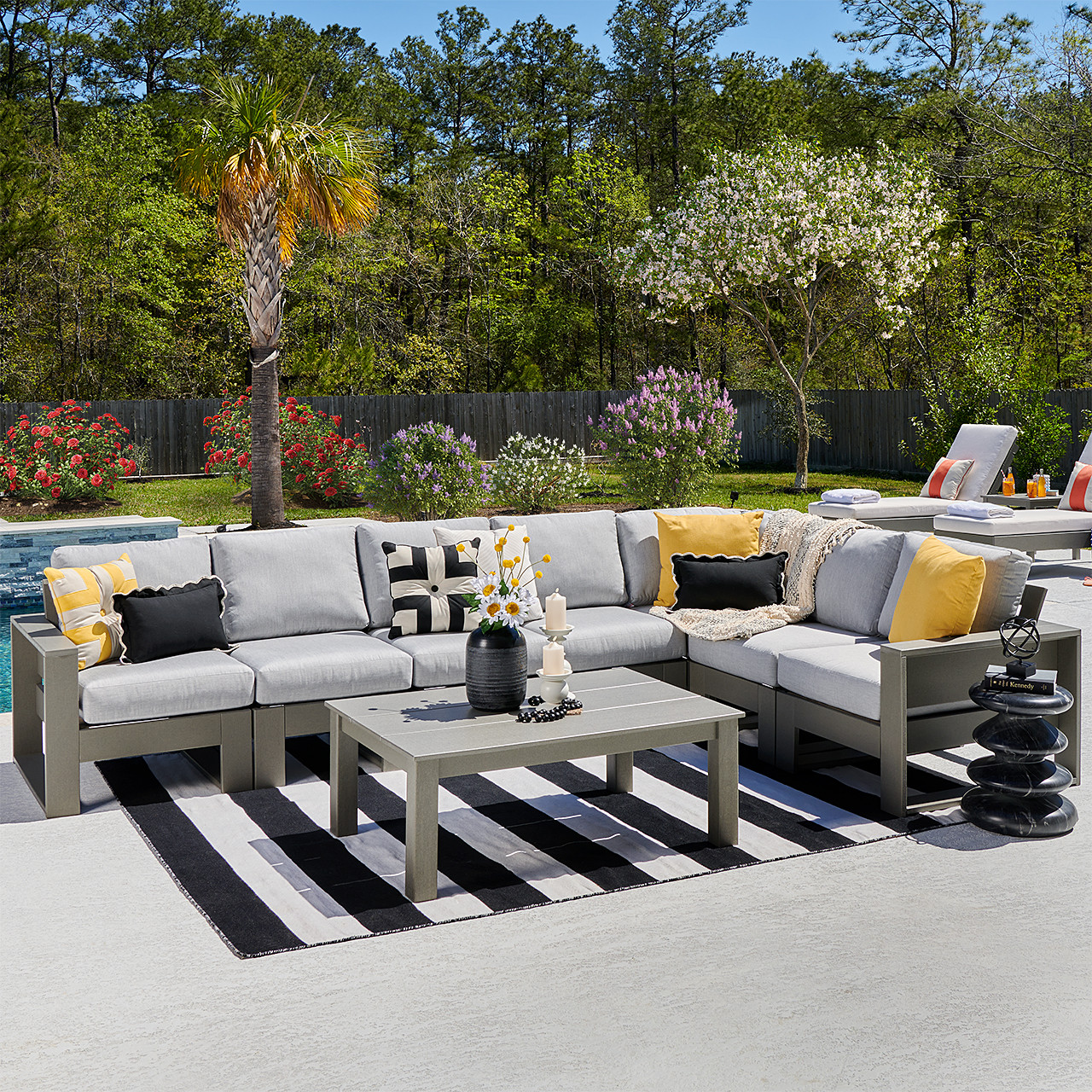 Montauk Polymer with Cushions 8 Piece Modular Sectional + 45 x 31 in. Coffee Table