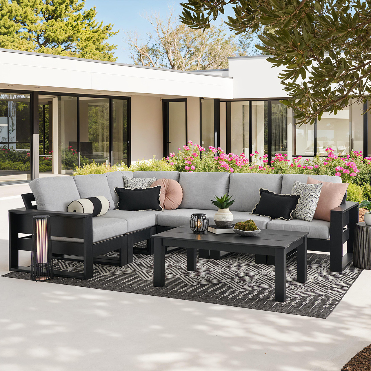 Montauk Polymer with Cushions 7 Piece Modular Sectional + 48 x 32 in. Coffee Table