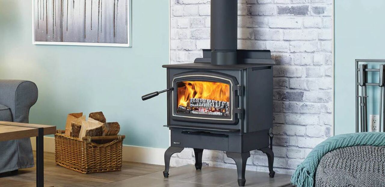 standalone woodburning fireplace by Regency Fireplaces in a living room