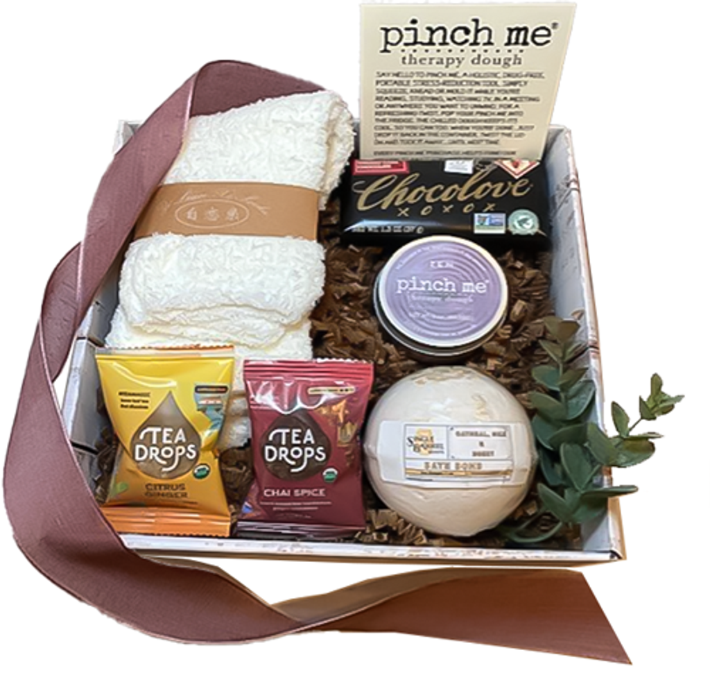 A thoughful gift box for someone who needs a little TLC.  Pinch Me theraph dough, cozy socks, assorted tea drops, bath bomb and a little Chocolove.  Your recipient will relax and enjoy some much needed self care.  The gift box will be wrapped with a coordinating tie bow.
