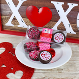 These festive Oreos are sure to help anyone feel the valentine spirit. Each package contains one dark chocolate Oreo cookie decorated with red, white, and pink nonpareil sprinkles; one dark chocolate covered Oreo cookie embossed with the image of red and pink hearts; and a milk chocolate covered Oreo wrapped in red foil.