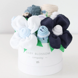 Celebrate the new mom or mom-to-be in the best way possible with flowers that are practical and oh-so-adorable.  The blooms: 1 bodysuit 1 bib 1 burp cloth 3 washcloths 3 pairs of socks, Sized 0-3months. Available in 3 unique collections - Neutral Baby Animals, Pink Ballerina, Blue Fox