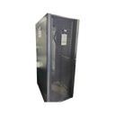 An angled front view of a black APC NetShelter SX 42U server rack enclosure featuring a perforated mesh front door and solid side panels