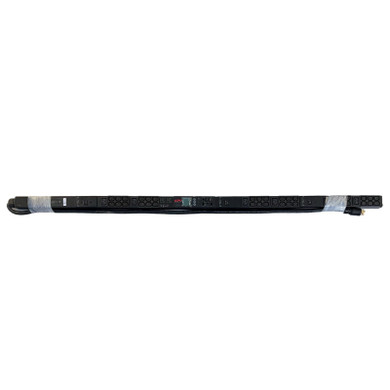 An APC AP8865 vertical rack PDU wrapped in clear protective plastic film, displayed horizontally against a plain white background.
