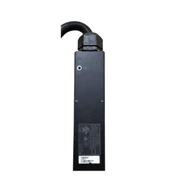 Close-up view of the top section and product specification sticker on an APC AP8832 Rack PDU, showing the power cord strain relief, grounding terminal, and barcode label.