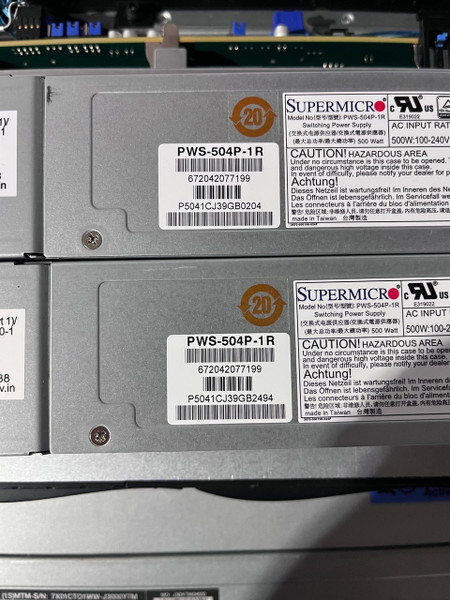 Zoomed-in photo of the dual power supply showing its part number