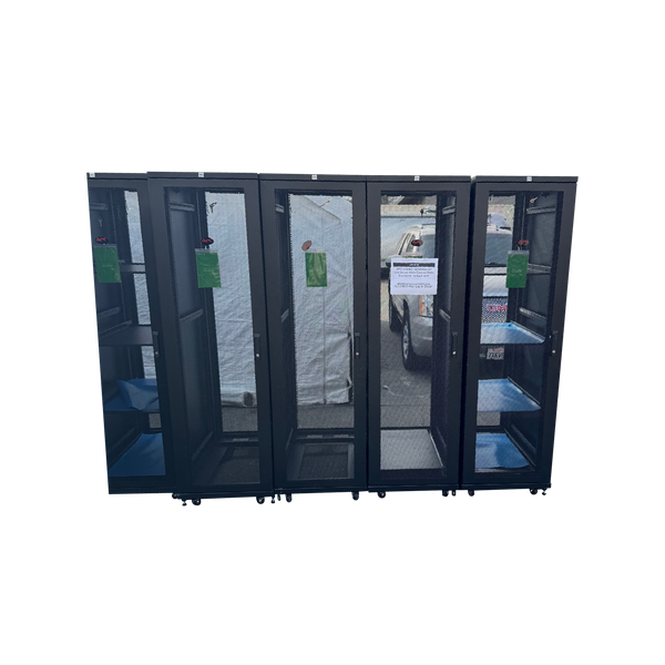 A straight-on front view of five black APC 42U server rack cabinets lined up side-by-side with perforated mesh front doors closed,