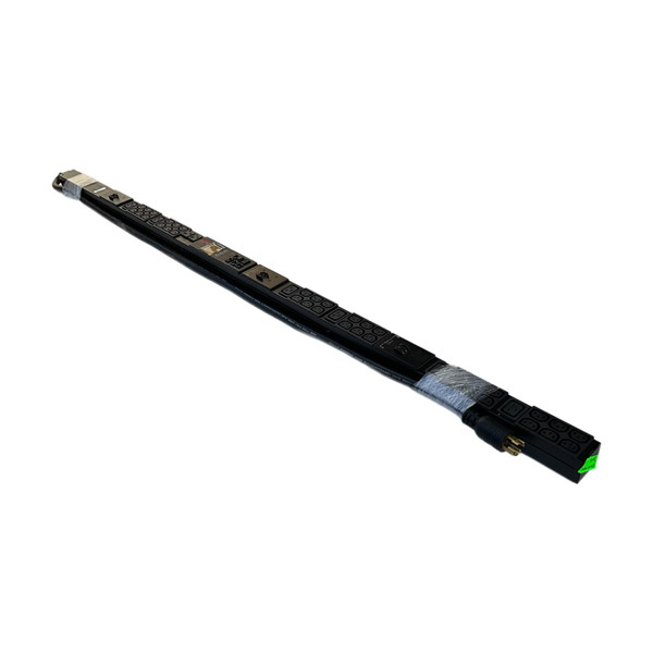 An angled full-length view of an APC AP8865 vertical rack PDU wrapped in clear protective film, displaying its power cord, plug, and outlet banks against a plain white background.