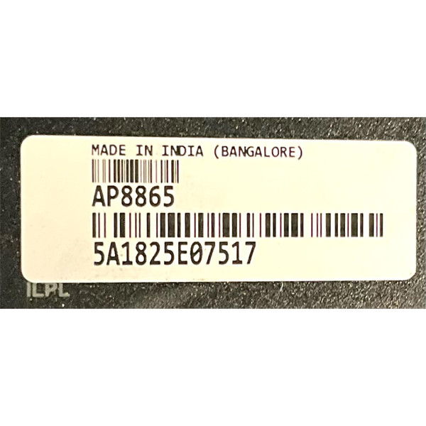 Close-up view of the white product sticker on an APC AP8865 Rack PDU, showing the model number, serial number barcode