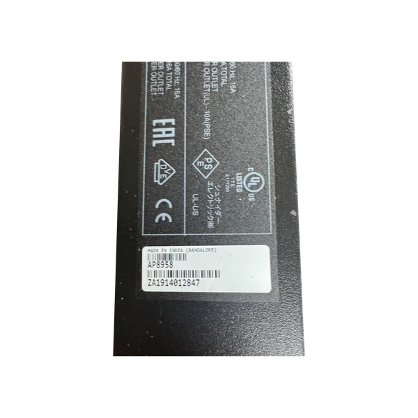 Close-up view of the serial number and rating label on an APC AP8958 Rack PDU