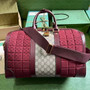 Gucci 724642 Mini GG canvas small duffle bag in Burgundy leather