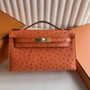 Hermès Kelly Pochette, Kelly Cuts Ostrich Leather - Color 1 - View 1