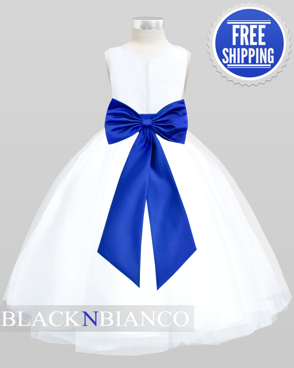 white dress with blue satin sash