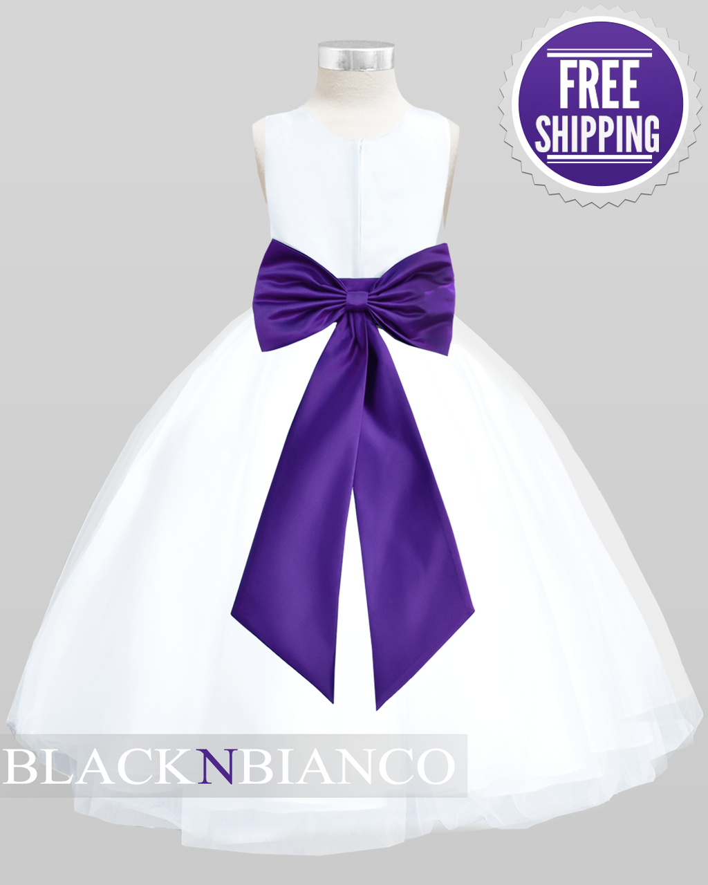 white flower girl dress with purple sash