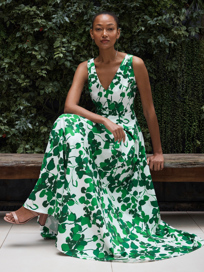 Model wearing green and ivory Almeria maxi dress