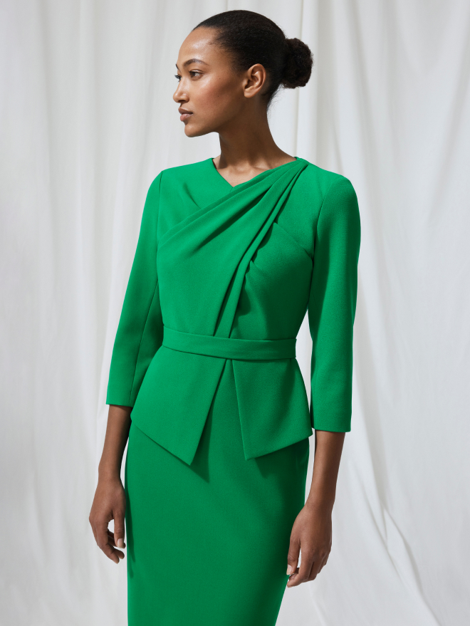 Model wearing emerald green Alina dress
