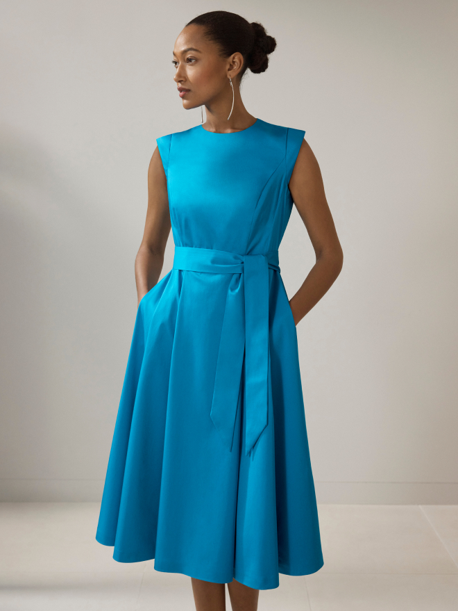 Model wearing turquoise Avola dress