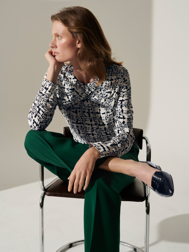 Model wearing Loire ivory and navy blouse