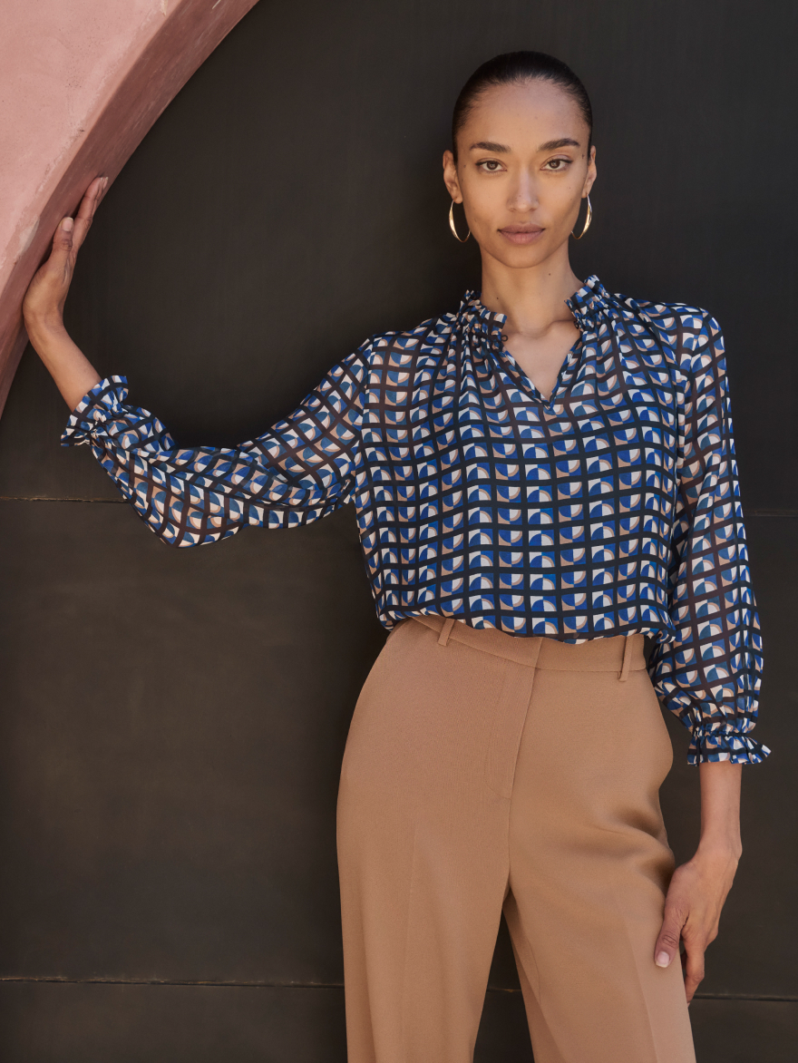Model wearing York navy and ivory blouse
