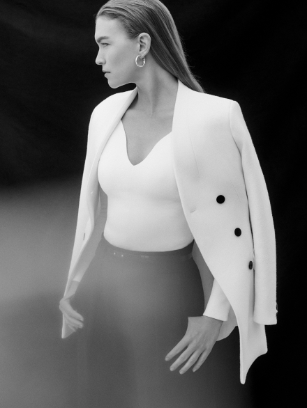 Model wearing ivory Kenwood jacket and Bouverie top