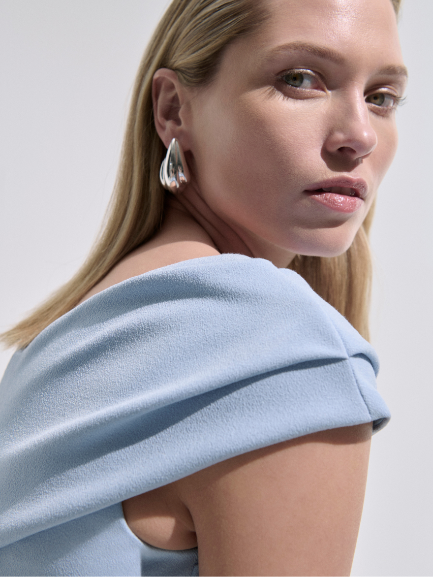Model wearing powder blue Luserna dress