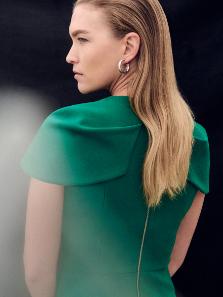 Model wearing cyanine green Alzano dress