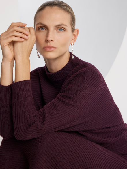 Model wearing dark red dress