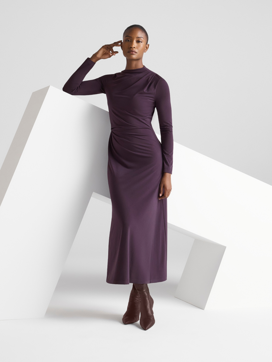 Model wearing new aubergine dress