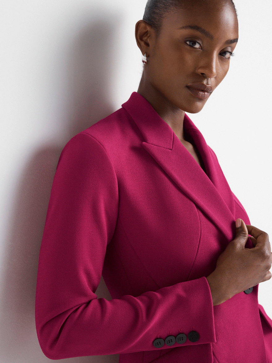 Model wearing magenta suiting