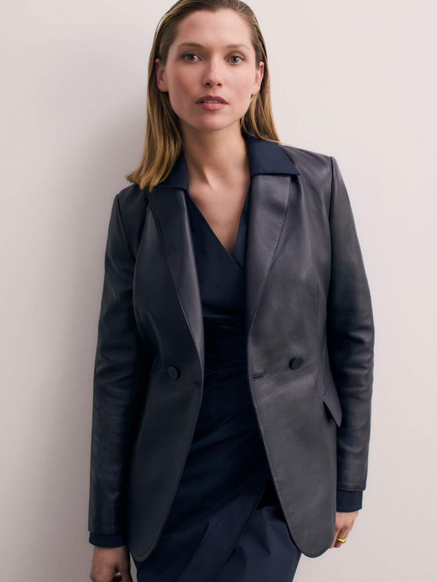 Model wearing navy Ginevra jacket