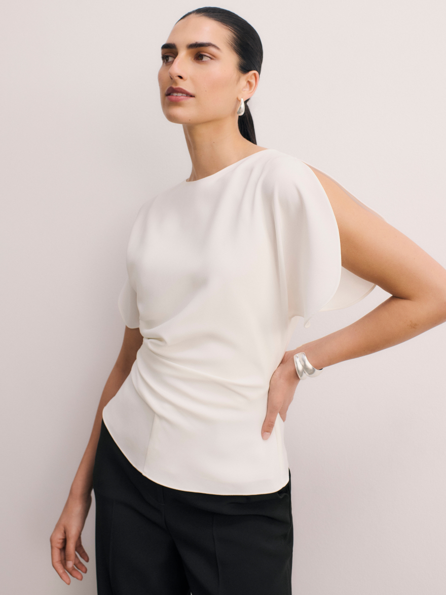 Model wearing white Salerno top