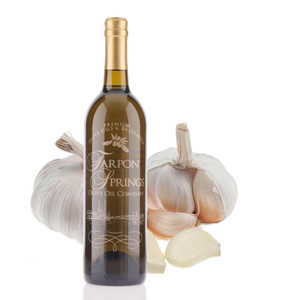 A 750mL bottle of Tarpon Springs Garlic Infused Olive Oil A 750mL bottle of Tarpon Springs Garlic Infused Olive Oil