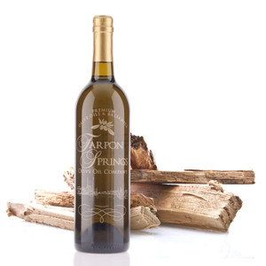 A 750mL bottle of Tarpon Springs Olive Wood Smoked Infused Olive Oil A 750mL bottle of Tarpon Springs Olive Wood Smoked Infused Olive Oil