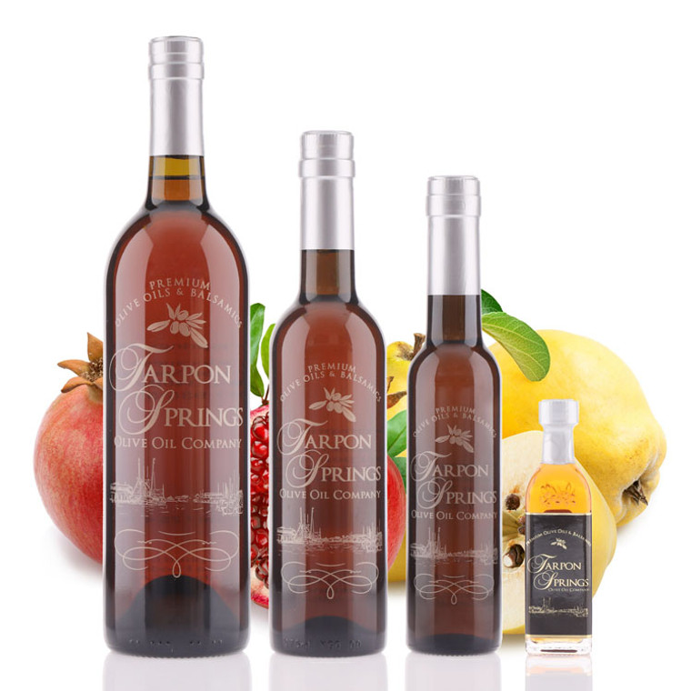 Four different size bottles of Tarpon Springs Pomegranate Quince White Balsamic Vinegar