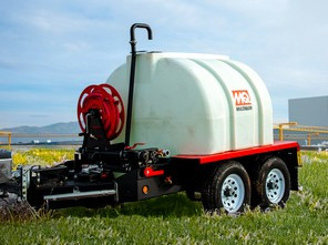 Side view of the Multiquip WTE8HP water trailer, showing the 800-gallon poly tank mounted on a dual-axle trailer with electric brakes.