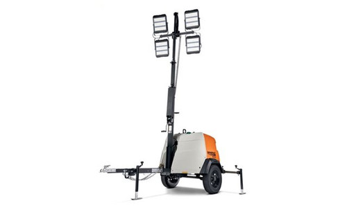 The Generac MLT6SMDS Mobile Light Tower is shown fully deployed with its 23 ft mast extended, illuminating a wide work area using four 320W LED fixtures.