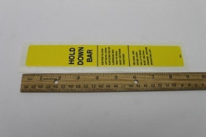 Genie Lift Part # 7061GT - DECAL,HOLD DOWN BAR, YELLOW, EA