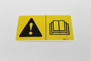 Genie Lift Part # 82487GT - DECAL, SYMBOL - READ THE MANUAL, EA