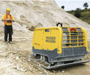 Wacker Neuson DPU110rLem970 US compacting soil on a construction site.