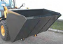 The Haugen HWL-FB 72-B 72" high-capacity fertilizer bucket is shown mounted on a skid steer, featuring reinforced plates and wear bars for enhanced durability.

