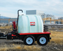 Angled shot of the trailer in a parked position, capturing the full layout including tank, trailer frame, and pump system.