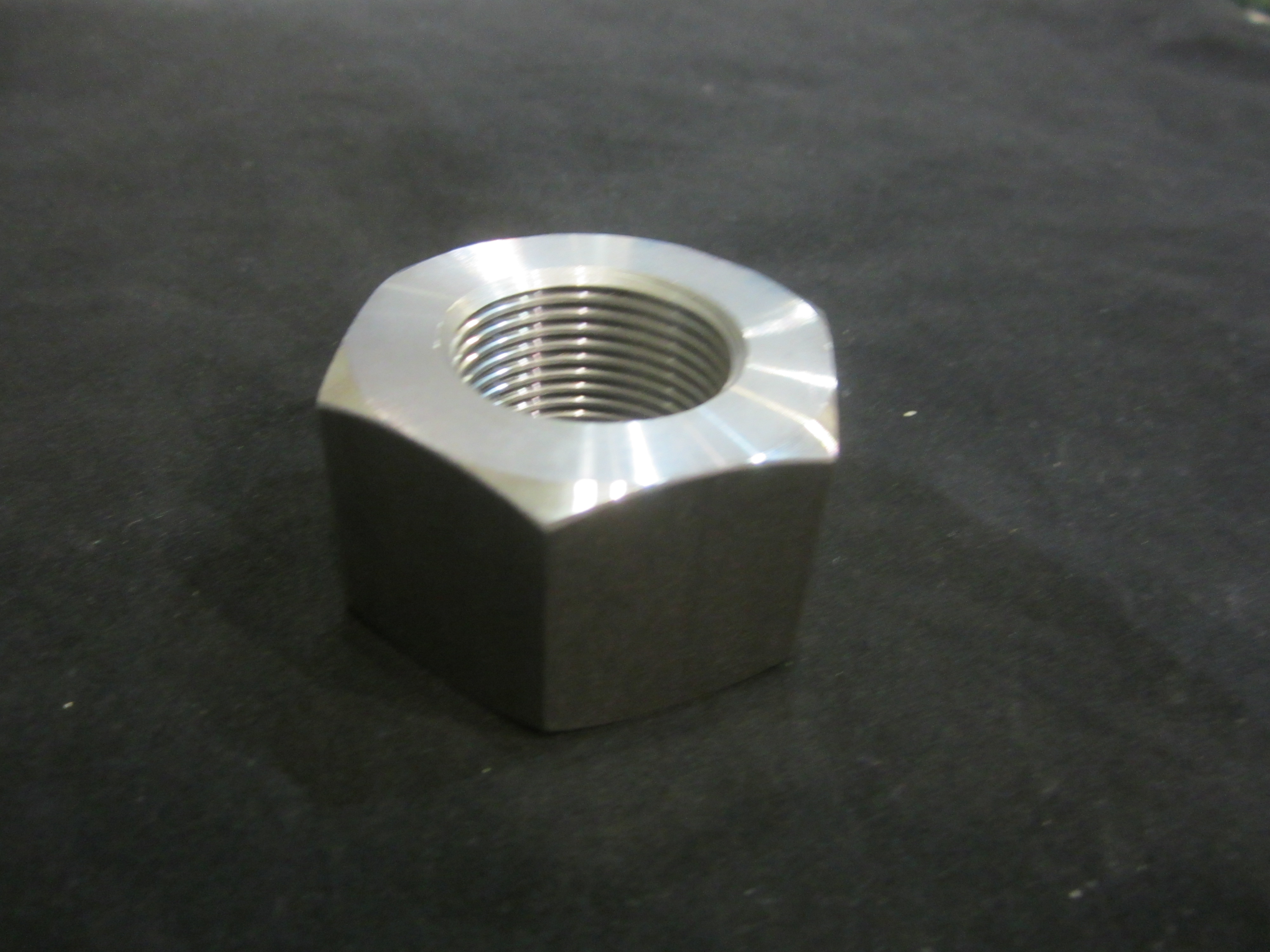 JLG Part # 3300281 | NUT-SPEC, HX 1.25-12X1.25 1018, EA