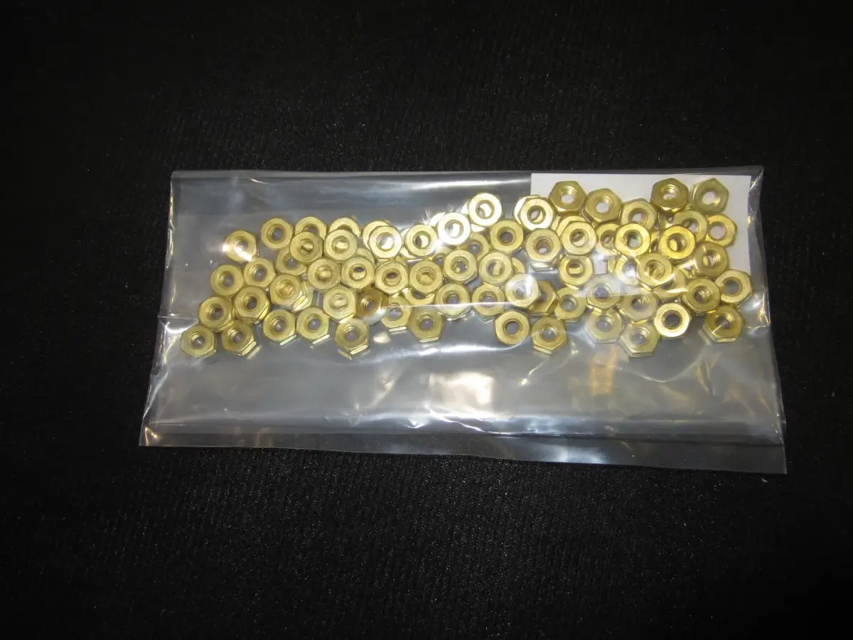 JLG Part # 3300379-100 | NUT-SPEC,HEX#8-32BRASS,QTY=100, PK